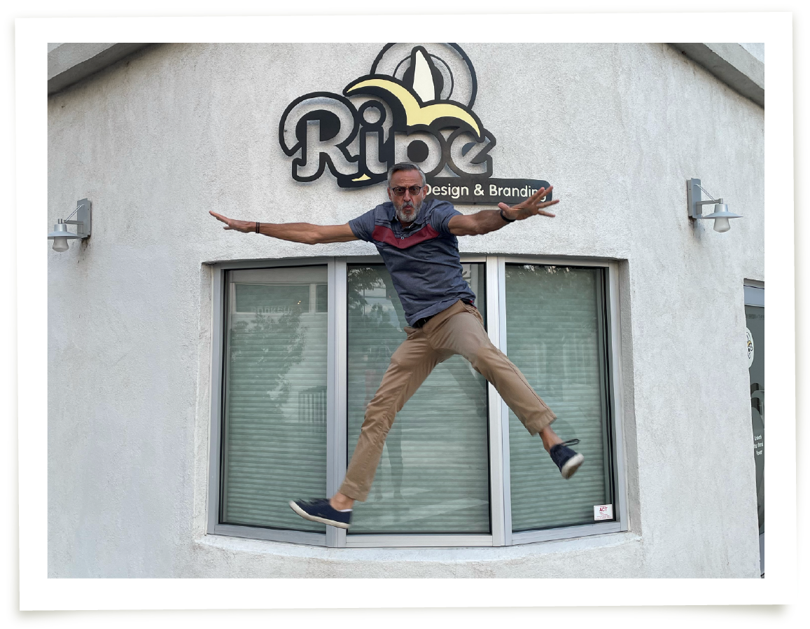 Len Romano catching air in front of Ripe's office in West Downtown, Albuquerque